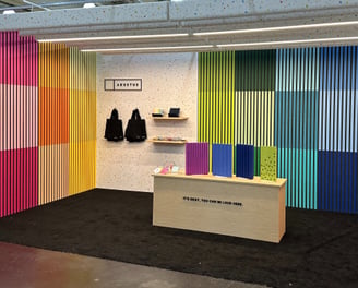 rainbow colored slatted madera acoustic panels AKUSTUS icff