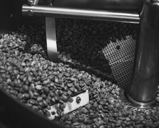 a coffee beanies being roasted in a coffee pot