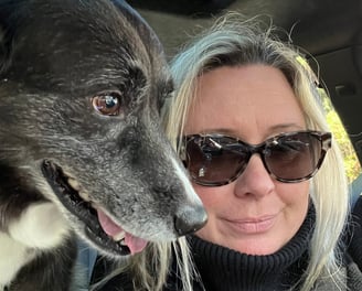 Natasha in car with dog