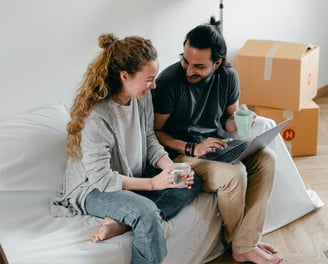 Happy couple on laptop