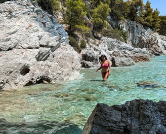 a woman in a bikinisuit standing in the water