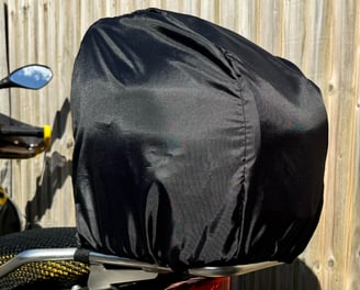 Motorsport helmet snugly secured inside a Remy fleece-lined helmet bag, showcasing soft interior
