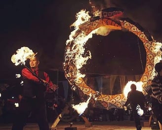 Fire Staff in front of large burning sculpture