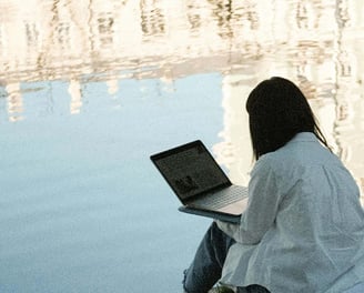 Person on laptop in the open