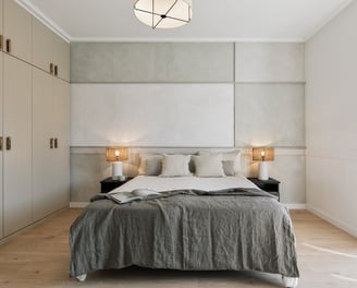 Elegant bedroom with subtle wall art, and calm beige tones, designed by SAVIA in Barcelona