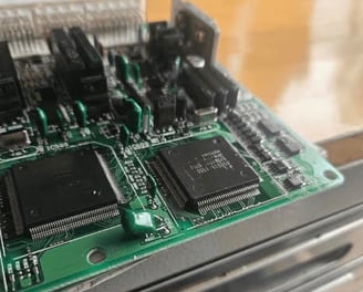 Close-up of car key programming device with electronic panel and diagnostic interface used by automotive locksmiths