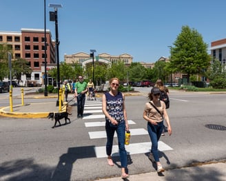 People walking across a crosswalk
