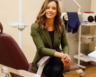 a woman sitting in a chair in a room