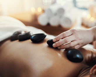 Full body hot stone massage for deep relaxation during Ballarat Winter Festival 2025 – warm winter t