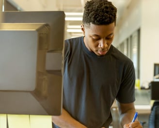 a person holding a wallet with a credit card