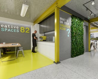 Industrial commercial space: concrete floors, exposed metal columns & beams, yellow features paint