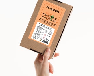 hand holding craft box with colored label