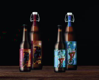 rye and barley beer bottles with labels, crow and woman acrobat illustrations