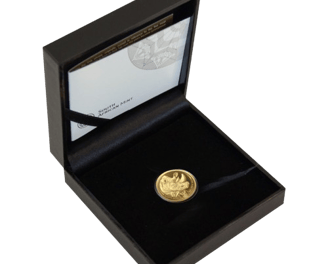 a gold coin with a black box and a gold coin