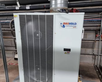 Maxx Cold split cooling unit mounted in a refrigerated storage room, providing precise temperature