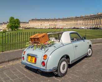 Nissan Figaro car with picnic basket