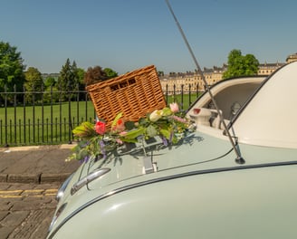 Picnic basket on back of Nissan Figaro