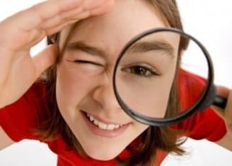 a girl holding a magnifying magnifying magnifying a magni