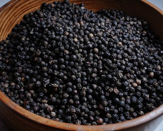 Black Pepper Placed on a Wooden Container