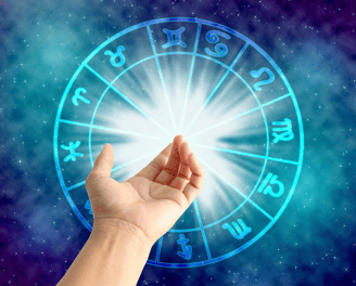 a person holding a circle of astrological signs
