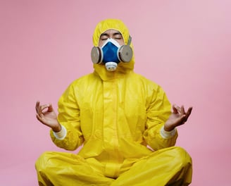 a man in a yellow raincoat and a gas mask
