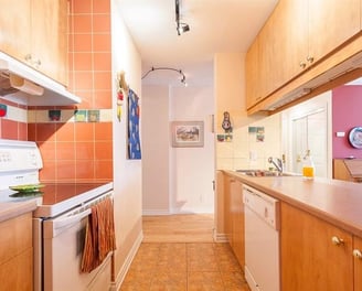 a kitchen with a stove top oven and a dishwasher