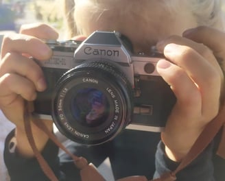 a woman taking a picture of herself taking a picture of herself