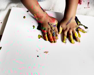 a child's hands painted with paint and paint