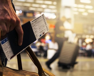 a person with boarding pass in an airport