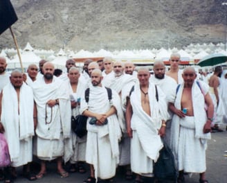 a group of men performing Hajj