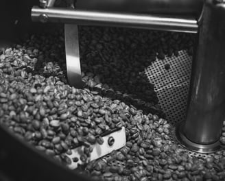 a coffee beanies being roasted in a coffee pot