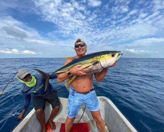 Anglers celebrating a successful yellowfin tuna catch in Makunduchi.