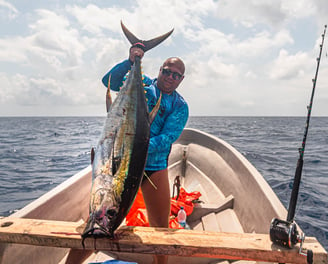 Latham Island Fishing Charters Zanzibar - Excited angler with a Yellowfin Tuna