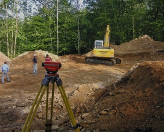 a man standing in front of a construction site