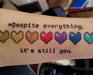 a tattoo of a quote on a person's arm