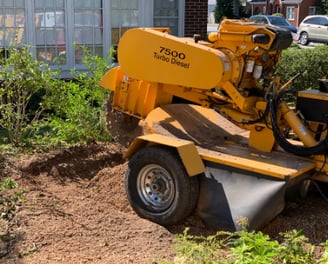 a machine is being used to remove dirt from the ground