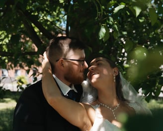 a bride and groom are posing for a photo