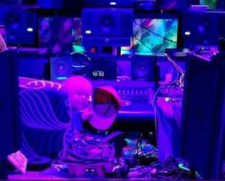 Kid sitting at the console in Deadly Mix Studios Dolby Atmos room