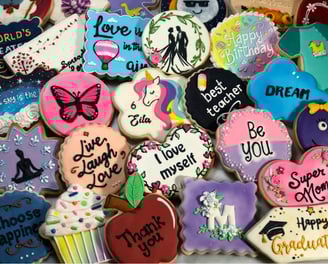 Beautifully decorated cookies with royal icing designs for various occasions custom-made for birthdays, weddings, baby shower