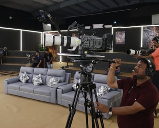 a man is filming a video camera and a camera