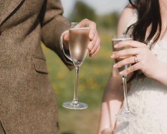 Bride and Groom share a glass of champagne