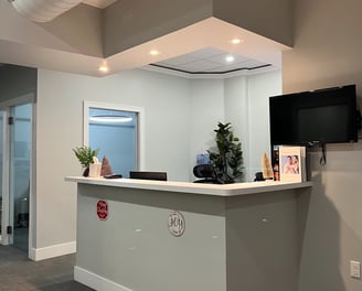 The receptionist area inside a dental office.