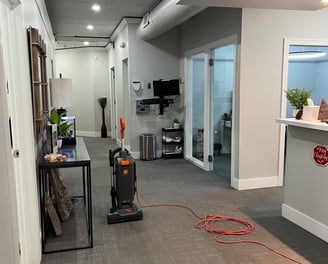 a vacuum cleaner cleaning a room inside a dental office