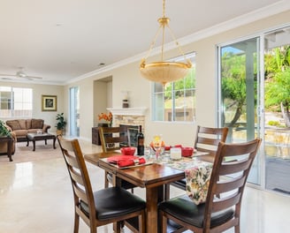 elegant living and dining area with easy access to an entertainer's backyard