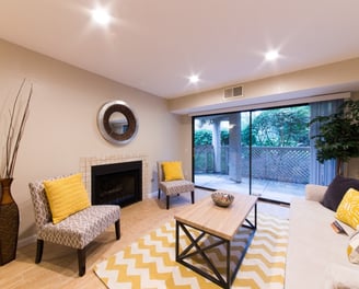 small cozy living room decorated to efficiently utilize space and provide comfort for guests