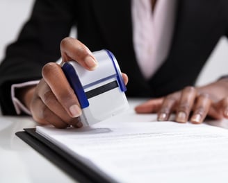 mobile notary stamping a parental concept form for travel