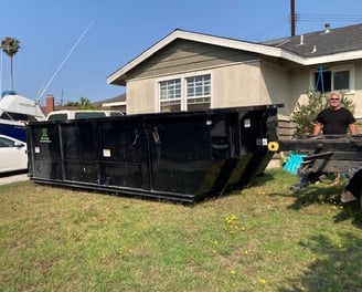 Our 18 cubic yard dumpster is ready for house junk cleanup