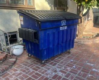 Our 3 cubic yard bin being filled with some wood, tile, and insulation.