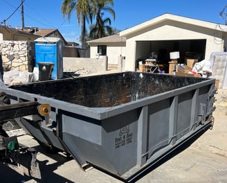 Our 11 cubic yard dumpster helping with a garage cleanup. 