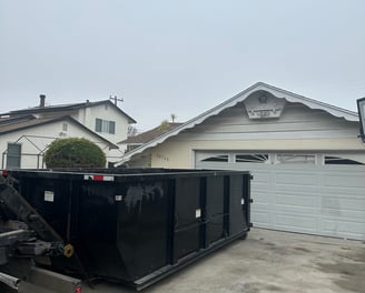 Our 18 cubic yard dumpster can be place on the driveway.